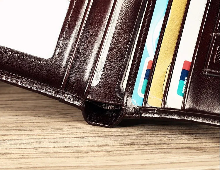 Men's leather wallet showing internal compartments including photo window, card slots and coin pouch