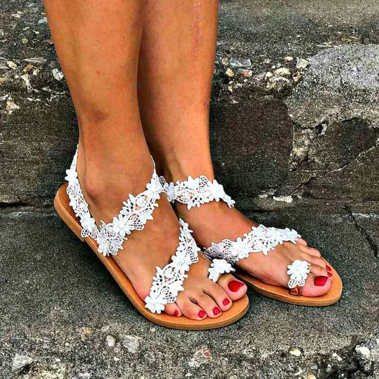 White women's flat sandals with rhinestone flower decoration and slip-on design