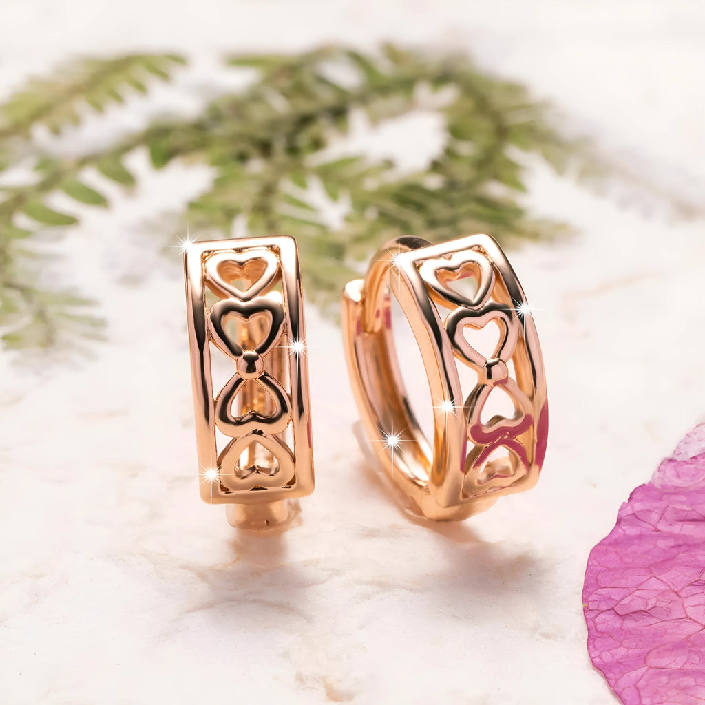 Love Glossy Hollow Ear Clip in rose gold copper electroplated earrings on display