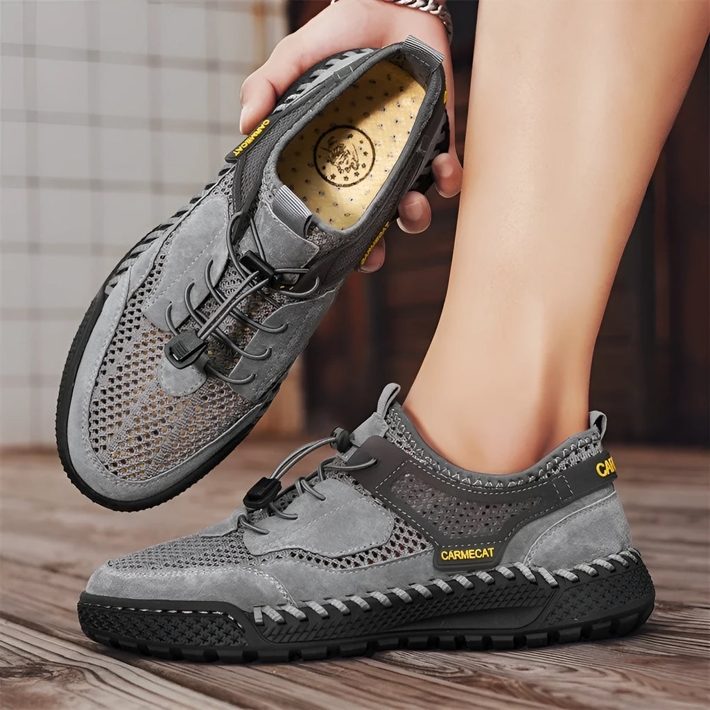 Men's brown suede casual tennis shoes with elastic band and hand-stitched details.