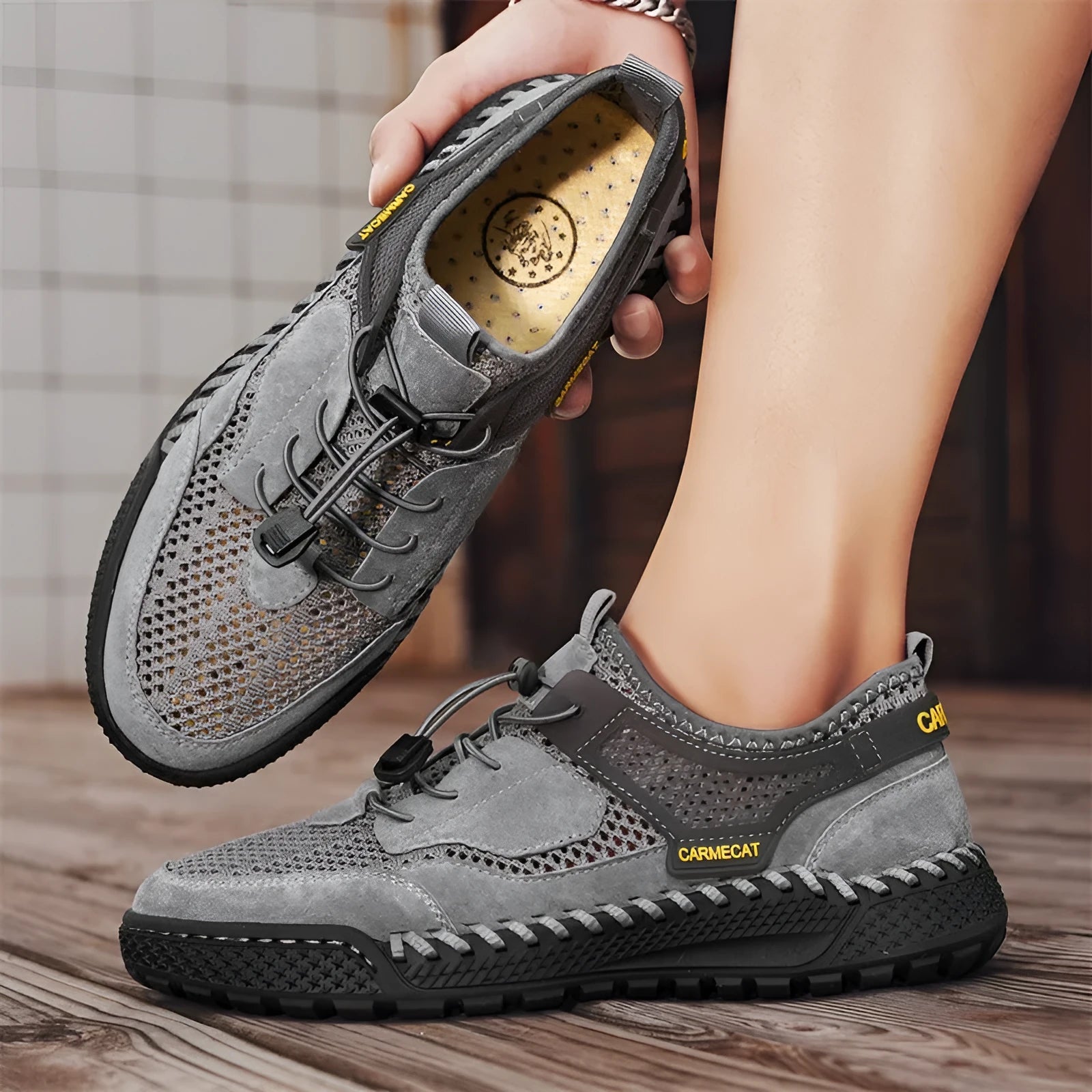 Men's brown suede casual tennis shoes with elastic band and hand-stitched details.