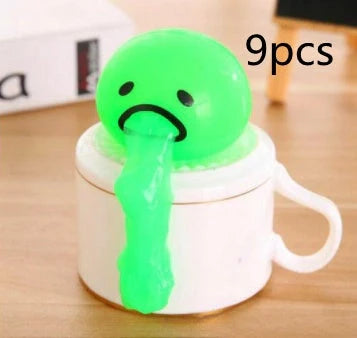 Gudetama Vomiting Egg Toy in green, orange, pink, and yellow