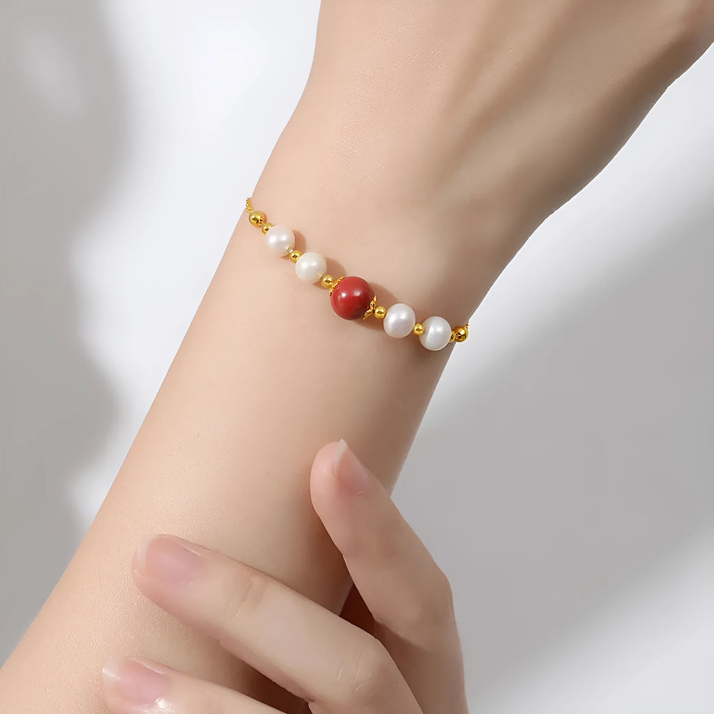 Yellow retro-style cinnabar bracelet for women made from 925 silver on a neutral background.