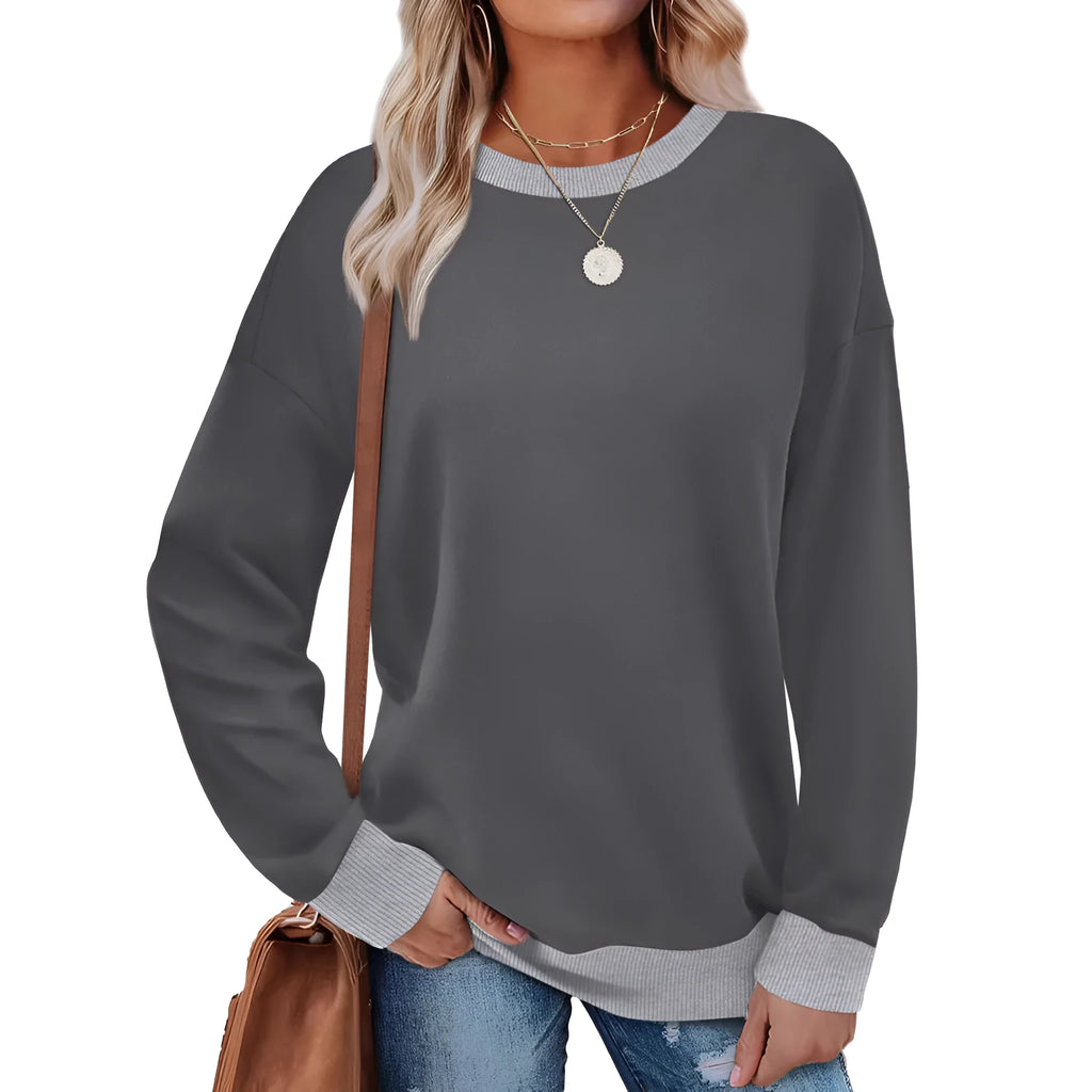 Women's loose round neck striped long sleeve top in apricot colour on a hanger.