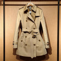 Khaki women's double breasted trench coat with long flight sleeves and button details