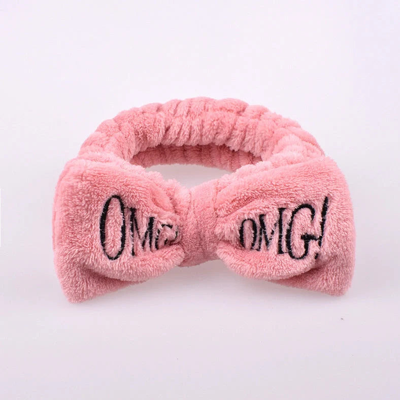 Coral velvet butterfly end hair band in pink with text styling, showing butterfly ends and cloth material