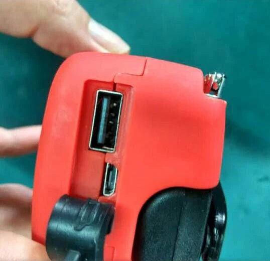 Red solar hand crank USB charging radio flashlight with AM/FM radio and LED light