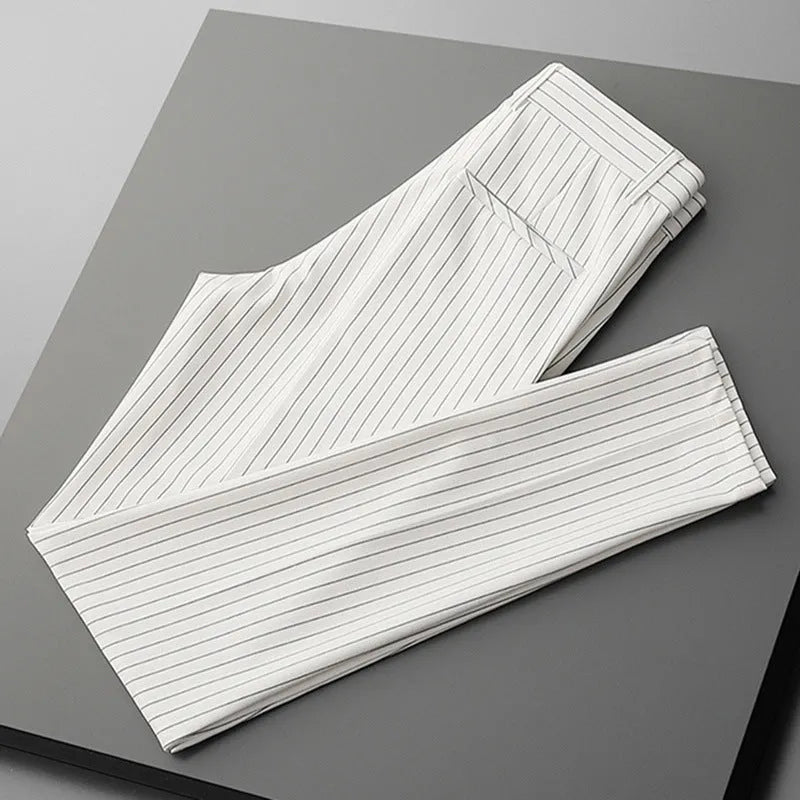 Men's thin loose casual suit pants showing draping design in black and white colour options