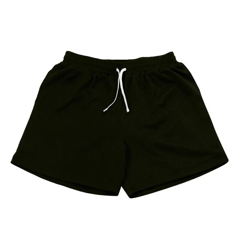Men's solid colour mesh quick-drying running shorts in black, shown on a hanger.