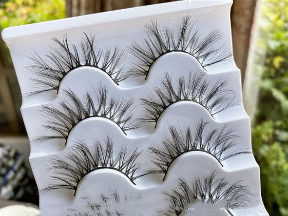 Black false eyelashes with 13mm length and curled messy cross pattern design