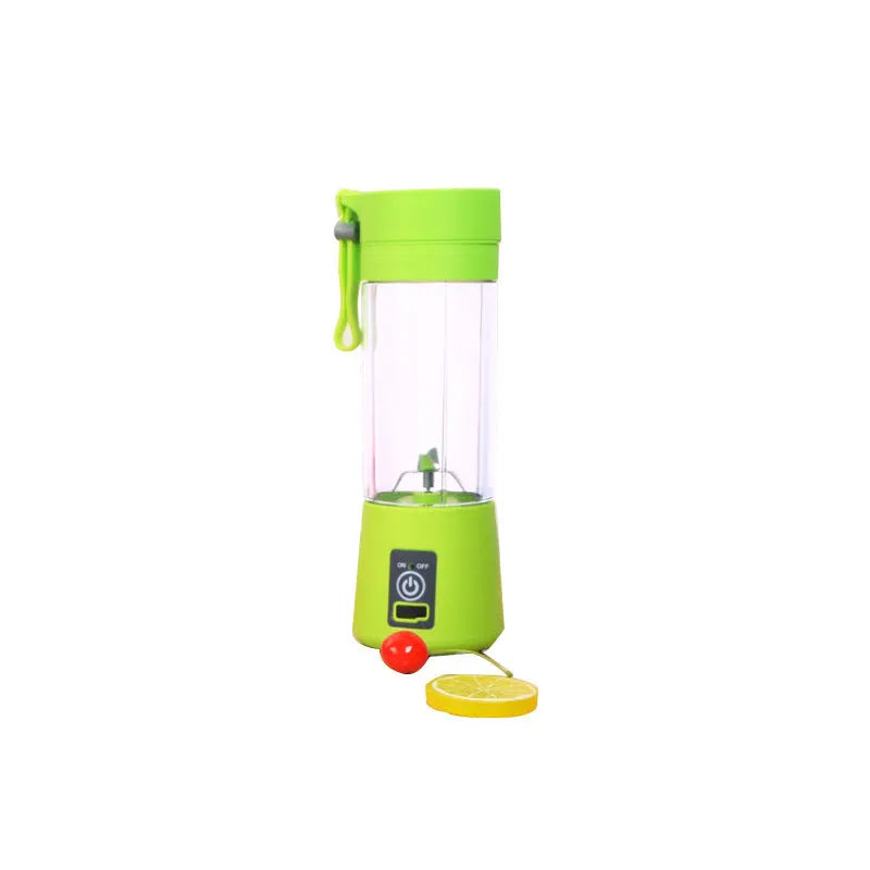 Mini USB-powered handheld fruit juicer with green plastic housing and a stainless steel blade.