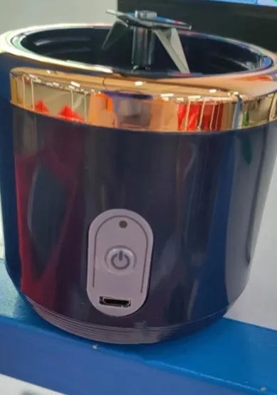 Tunisian dark blue portable blender and juicer with six blades, USB cable, and 400ml cup.
