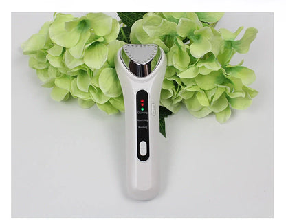 Electric Ultrasonic Facial Beauty Device in white, compact design for skincare