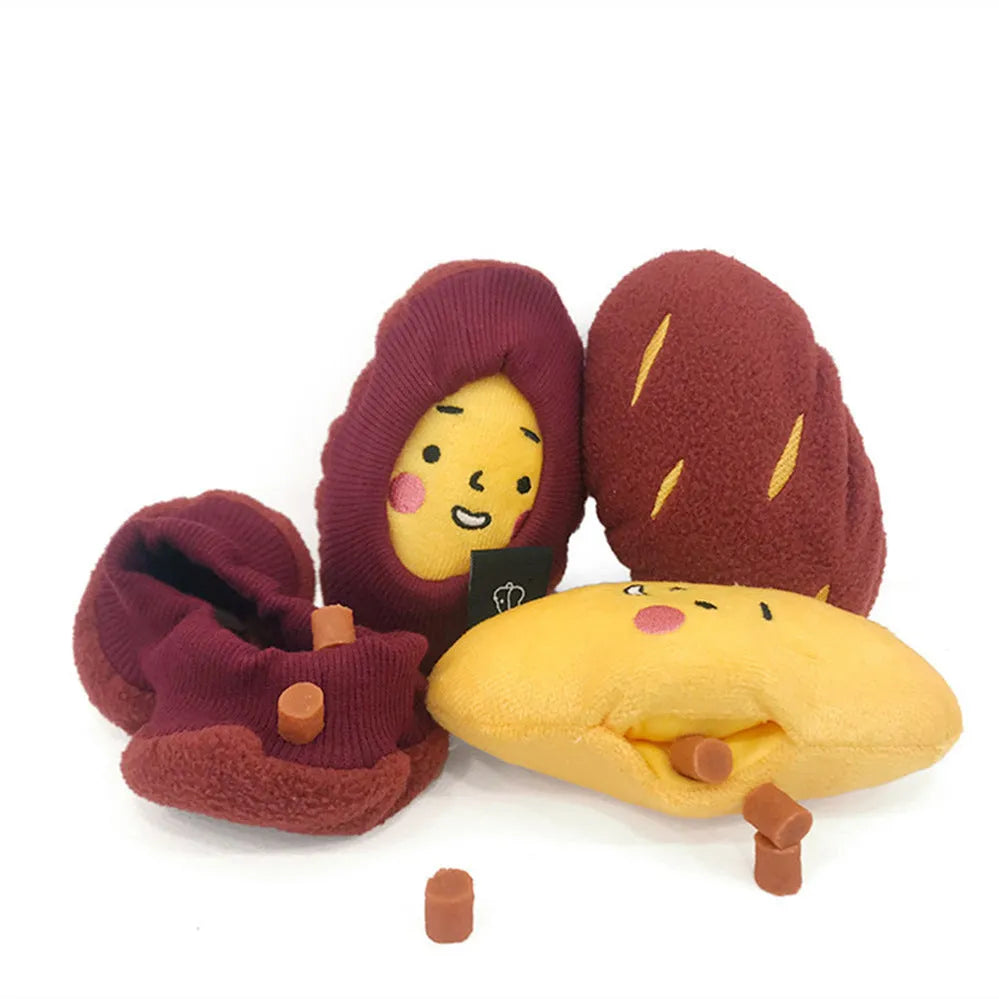 Red sweet potato-shaped dog toy with a peelable layer and hidden treat pocket for interactive play.