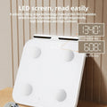 White professional body fat scale with 8 electrodes, tempered glass platform, and LED display.