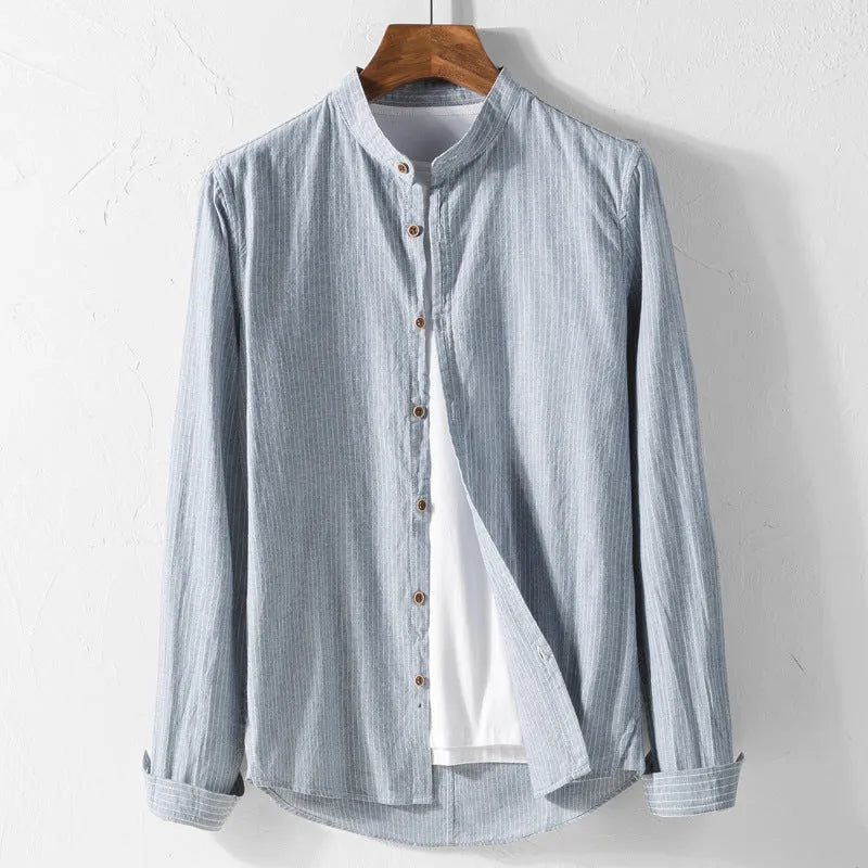 White long sleeve cotton shirt with classic fit, collared neckline, and button front