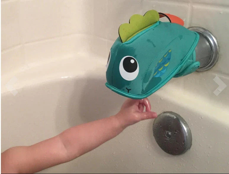 Whale-shaped bath tap safety cover with adjustable closure, designed to protect baby's head during bathtime