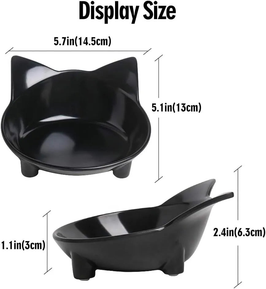 Black shallow cat food bowl with non-slip rubber base on kitchen floor