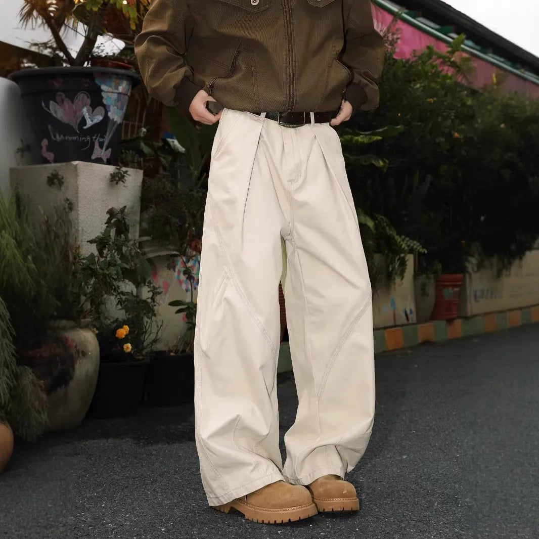 Men's pleated straight-leg trousers in a loose fit, shown in apricot colour with striped pattern.