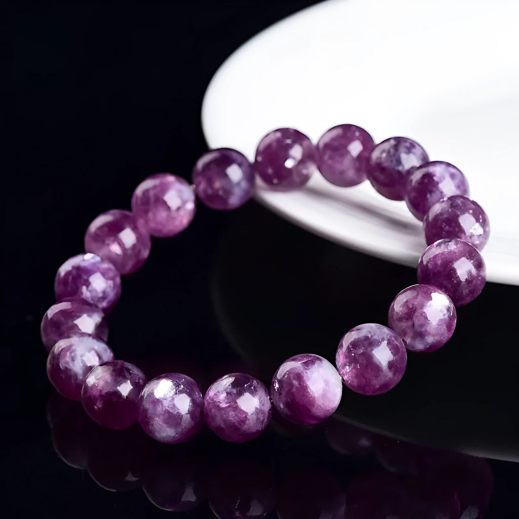 Geometric Korean-style polished crystal bracelet showing pink, pink purple, and purple colour options.