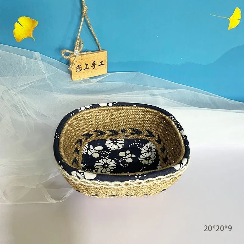 Blue square plastic storage basket with woven texture on a wooden tabletop.