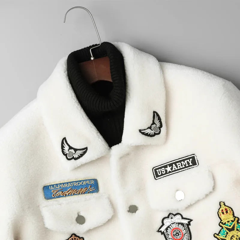 Men's 100% wool lamb fur jacket in white and black animal pattern, button front, long sleeves, on a model