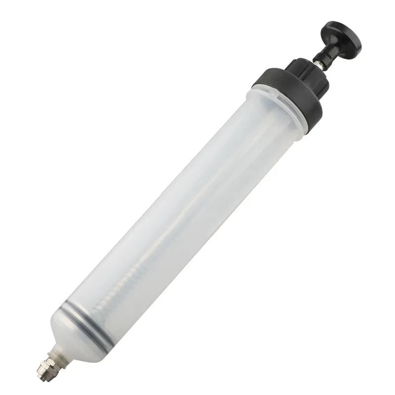 Manual pumping barrel oil change tool with dual suction injection capability