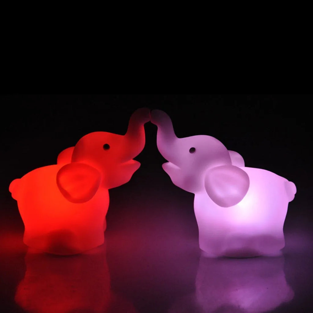 Elephant night light with 7 colour changing slow flashing modes, vinyl body, size 8x8.8x4.5cm, battery powered