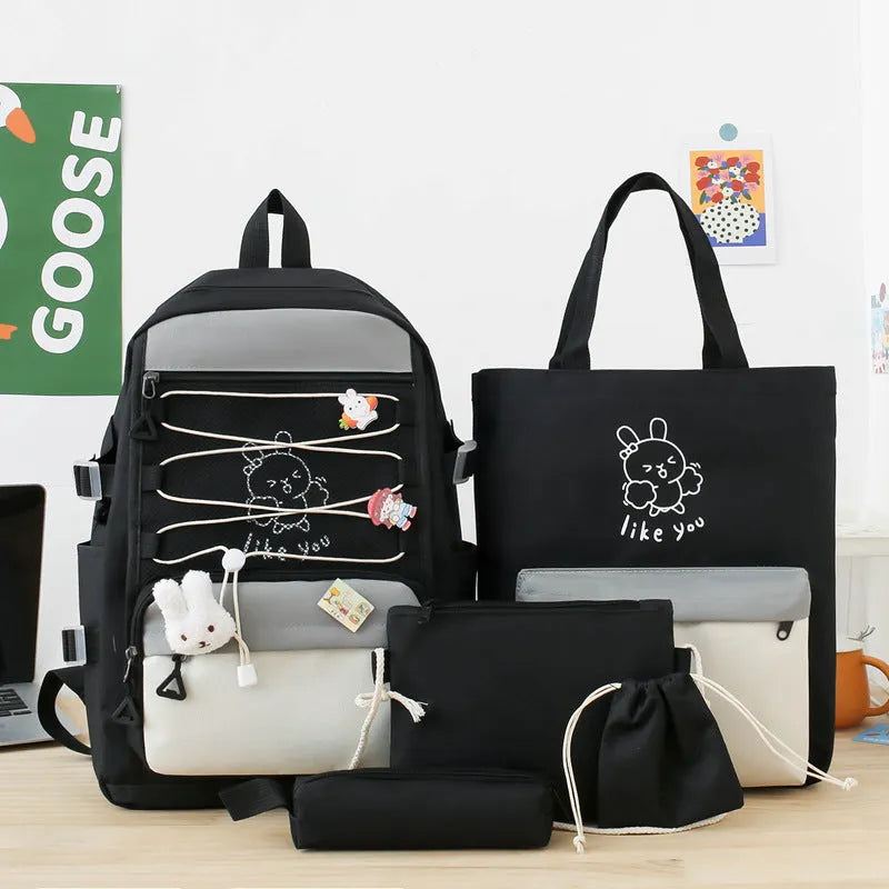 Lightweight large capacity student backpack in nylon, showing curved shoulder straps and solid colour options.
