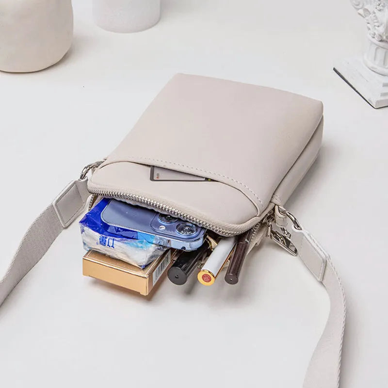 Solid colour PU leather crossbody phone bag in beige, shown with strap.