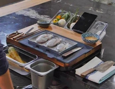 Versatile bamboo cutting board with integrated storage trays for organized meal prep