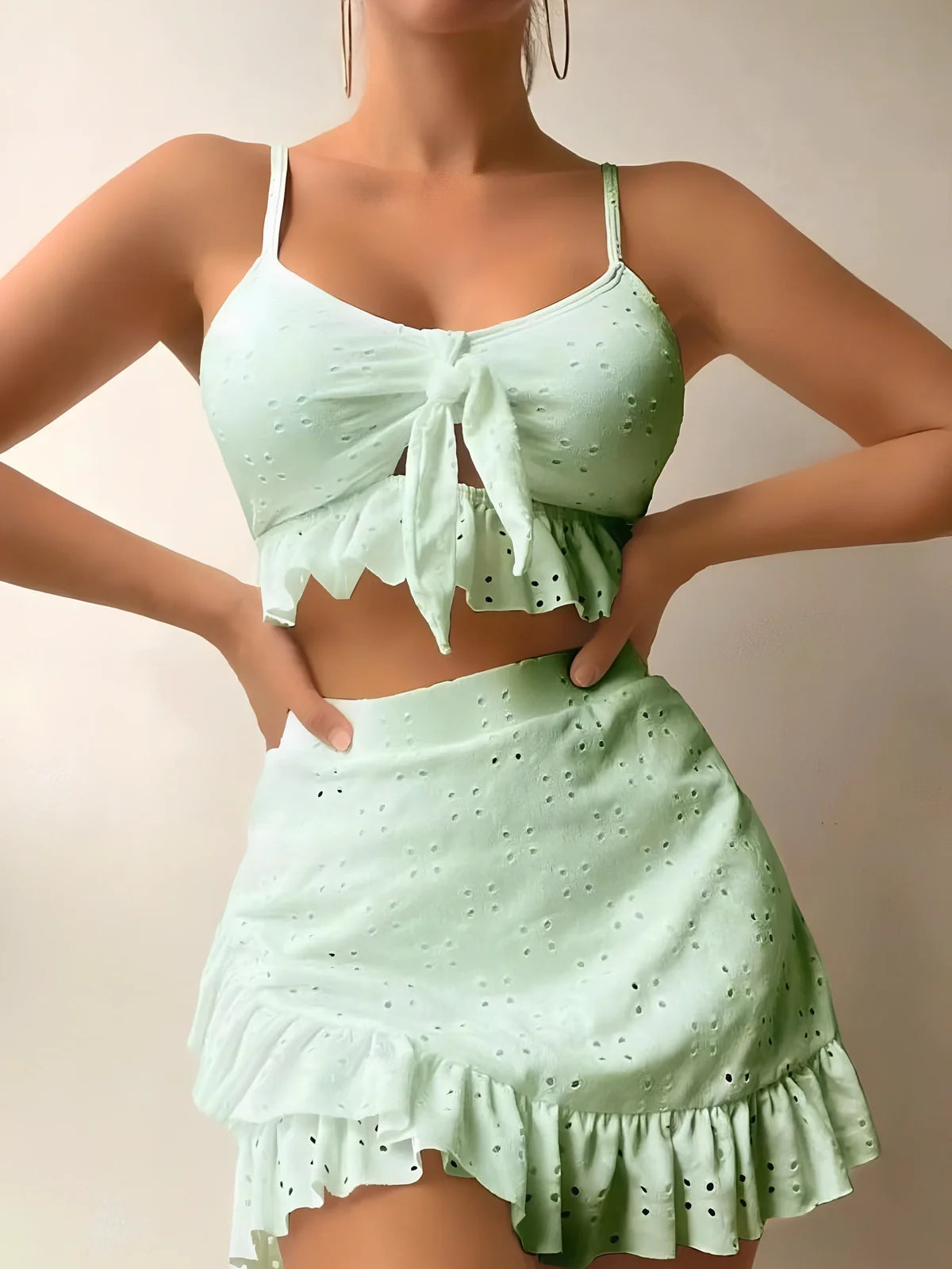 Women's 3-piece bikini set with hip-hugging skirt and ruffle detailing in polyester swimwear