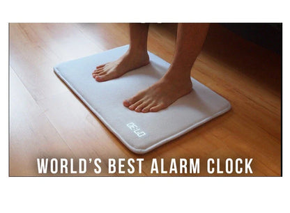 Innovative alarm clock carpet with touch-sensitive design, bright LED display, and high-density memory foam for comfort