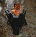 Hexagon-shaped foldable alcohol stove for camping in black or silver colour