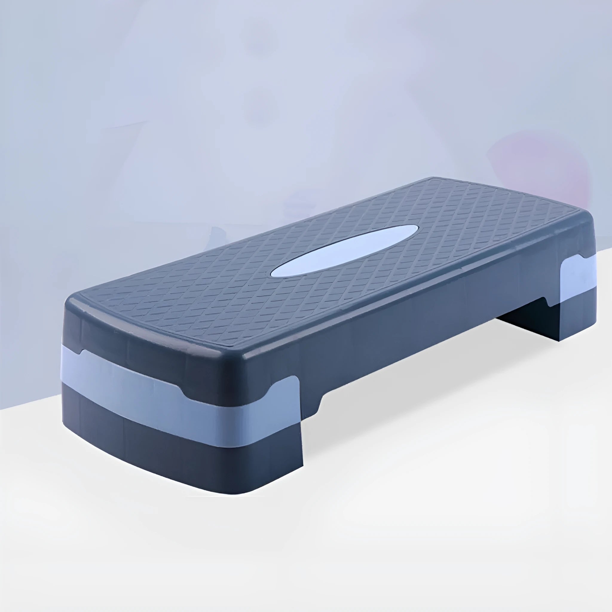 Grey ABS plastic aerobic step platform for fitness workouts, showing its size and texture.