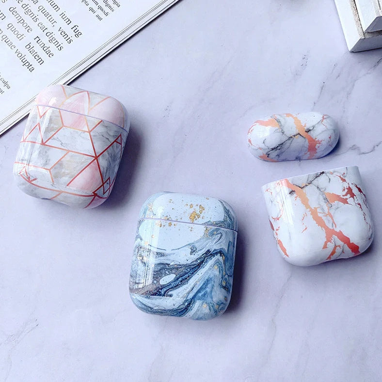 White marble pattern AirPods protective case with hard PC construction showing charging port access