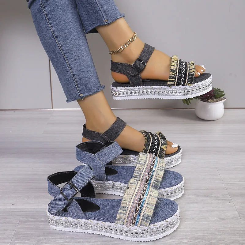 Women's tassel denim sandals with thick flat sole and buckle closure in blue