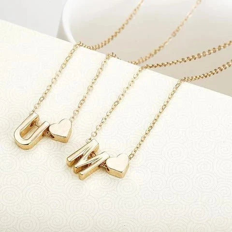 Heart-shaped letter pendant necklace with clavicle chain design in gold and silver tones