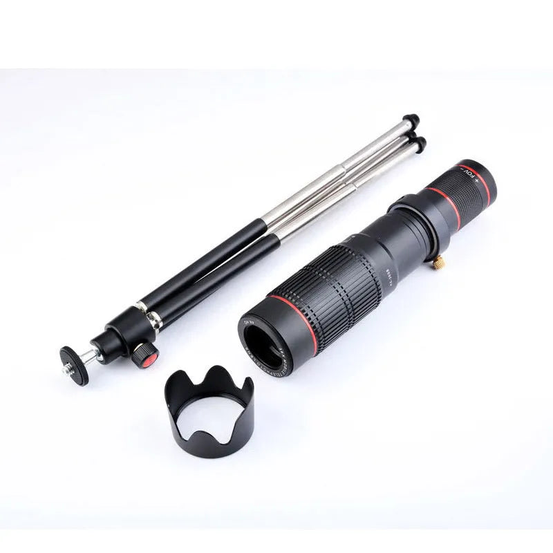 Black 36x telephoto mobile phone telescope with universal clip and carrying pouch on a table.