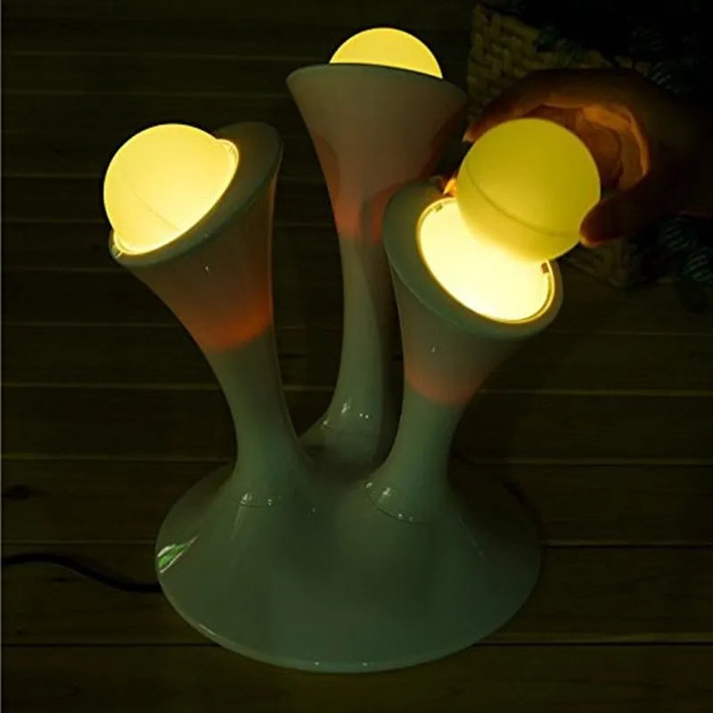 Decorative mushroom lamp with colourful LED gradient glow on bedside table, 21.5cm height