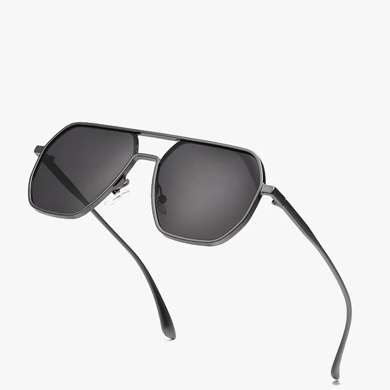 Men's polarised sunglasses with irregular frame in black, gold, or gunmetal with UV protection lenses.