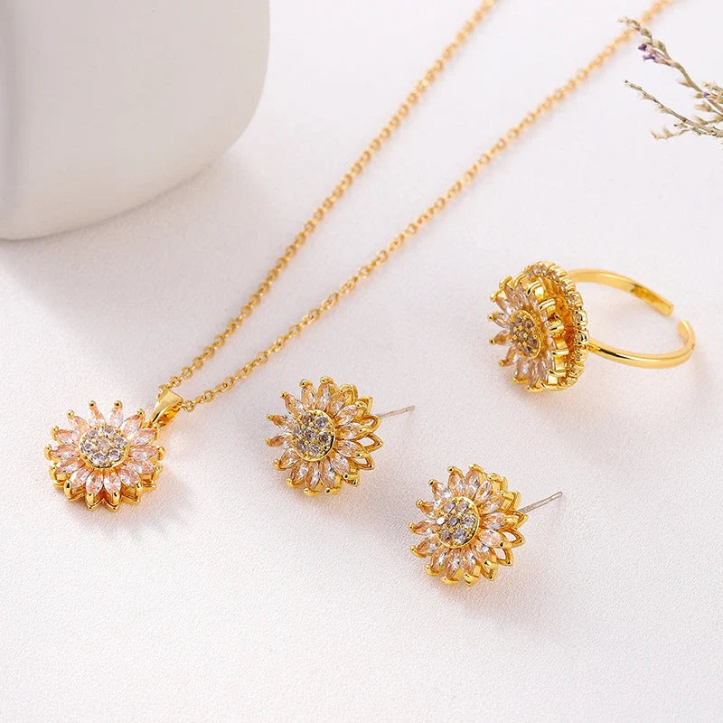 Sunflower-themed stainless steel jewellery set with zircon accents, including necklace, earrings, and ring