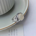 Copper adjustable vintage ring with imitation white chalcedony stone and antiqued finish