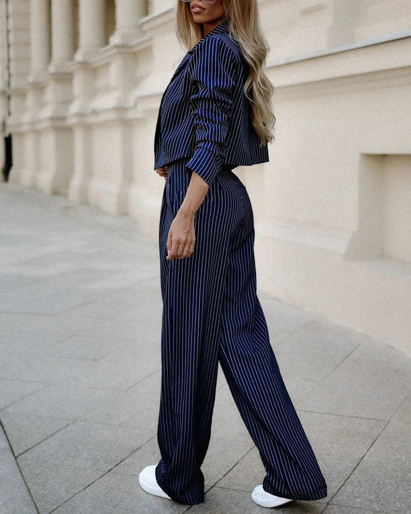 Stylish striped casual suit with cropped top and straight-leg pants in gray, dark blue, and black colors