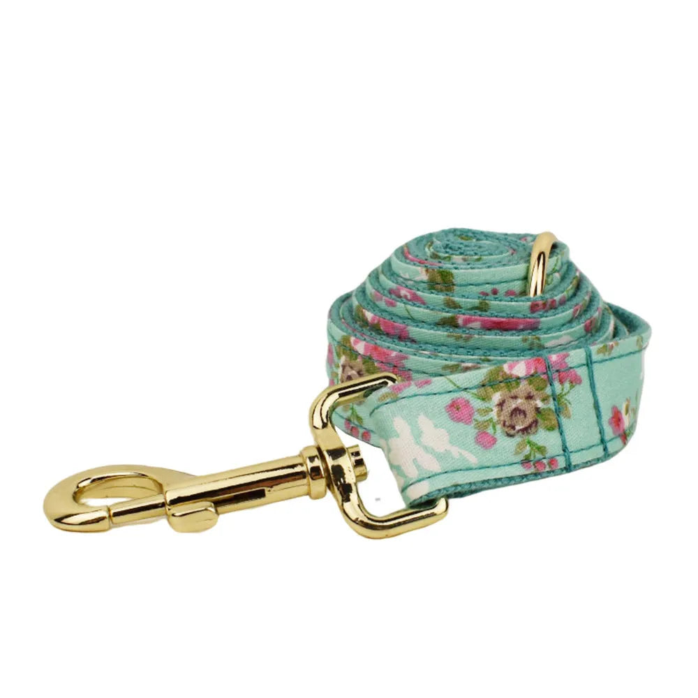 Rose pattern dog collar set with green background including collar, leash, and detachable bow
