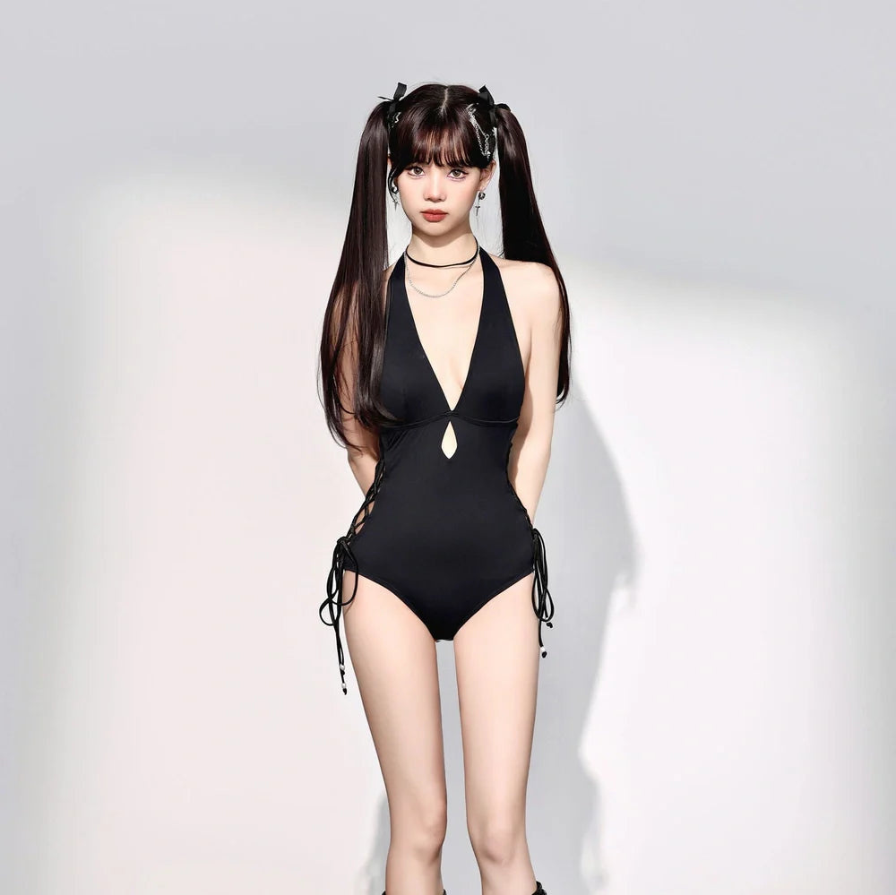 Black women's one-piece swimsuit with V-neck design and hollow straps, polypropylene fibre fabric