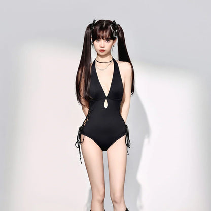 Black women's one-piece swimsuit with V-neck design and hollow straps, polypropylene fibre fabric