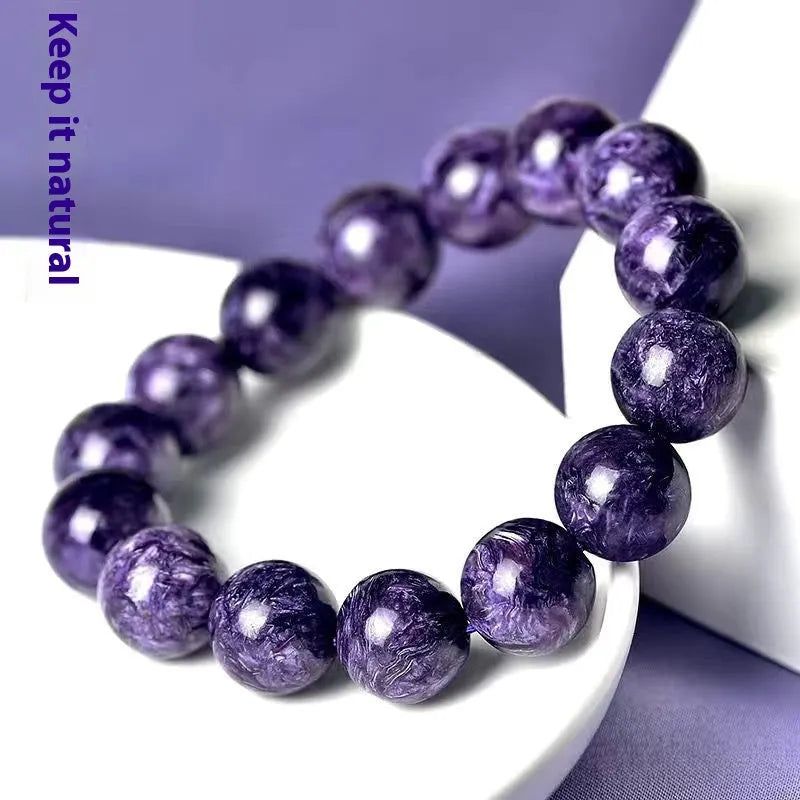 Natural transparent charoite crystal bracelet with platinum beads in four size options.