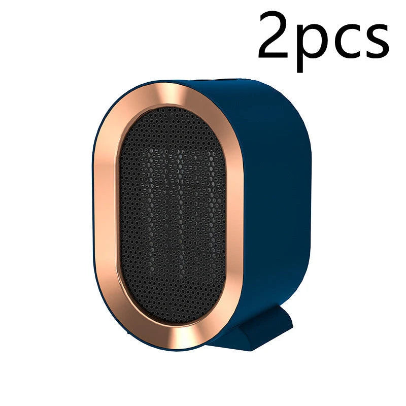 Mini Portable PTC Ceramic Heater on a desktop, showcasing its compact design and efficient heating.