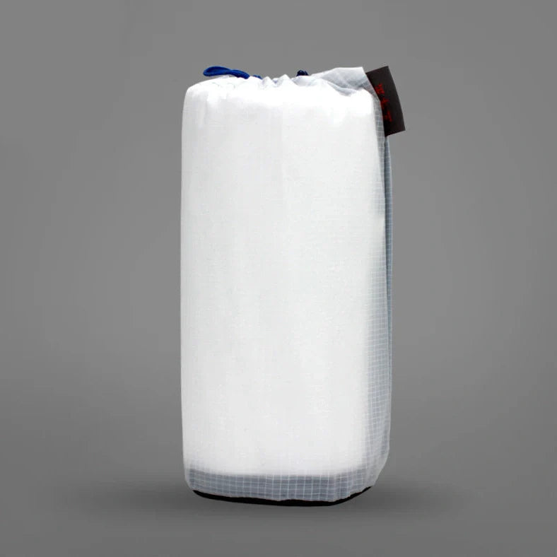 White rectangular camping sleeping bag made from DuPont TYVEK material showing 230cm length dimensions